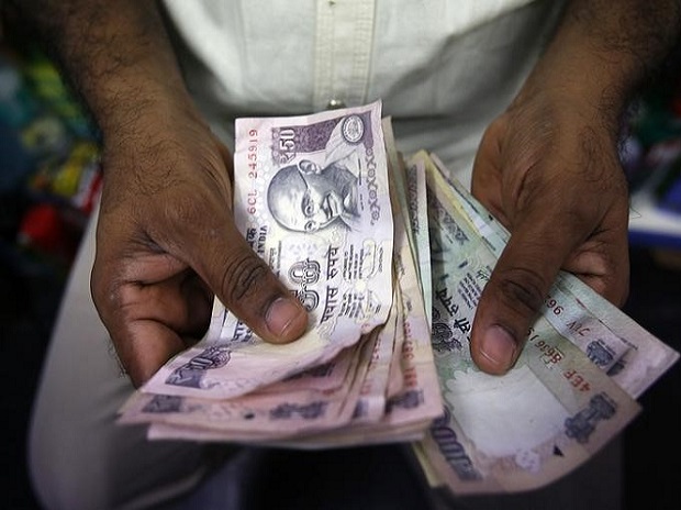 A private money trader counts rupees at a shop in Mumbai. Photo:Reuters A private money trader counts rupees at a shop in Mumbai. Photo:Reuters