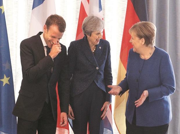 French President Emmanuel Macron with British PM Theresa May and German Chancellor Angela Merkel before the EU-Western Balkans Summit in Sofia on Thursday