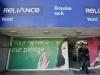 A customer leaves a Reliance communications store in Ahmedabad