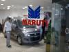 The logo of Maruti Suzuki India Limited is seen on a glass door at a showroom in New Delhi