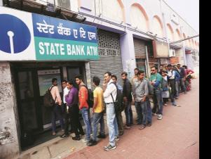 Line of discontent: People queue outside an ATM of State Bank of India to withdraw money in Kolkata