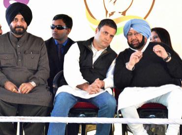 Congress Vice President Rahul Gandhi with party leaders Navjot Singh Sidhu and Captain Amarinder Singh during a rally in Majitha. Photo: PTI
