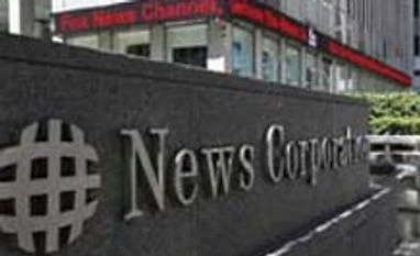 News Corp shareholders approve split