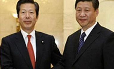 Japan PM urges reset in ties at first meet with China's Xi