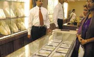 Gold softens on poor offtake, silver drops