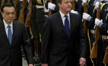 Cameron strikes big deals on his fence-mending visit to China
