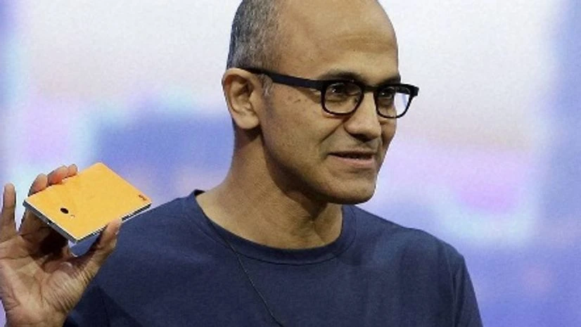 Microsoft CEO Satya Nadella holds up the Nokia Lumia 930 phone that uses Windows 8.1 during the keynote address of the Build Conference Wednesday, April 2, 2014, in San Francisco Microsoft CEO Satya Nadella holds up the Nokia Lumia 930 phone that uses Windows 8.1 during the keynote address of the Build Conference Wednesday, April 2, 2014, in San Francisco
