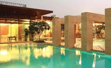 DLF soars 14% on strong June-quarter results A view of the swimming pool area at DLF Aralias