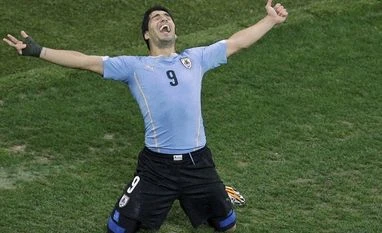 Suarez double sends England on verge of elimination