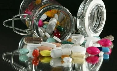 USFDA informs Biocon, Mylan of deferred action on biosimilar license plea Medical illustration : Pills of all kinds, shapes and colours