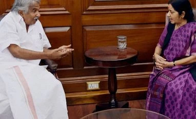 Trying to bring back bodies of nurse, son killed in Libya: Kerala CM External Affairs Minister Sushma Swaraj with Chief Minister of Kerala, Oommen Chandy during a meeting in New Delhi