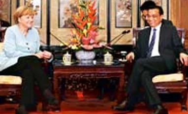 German spy warns firms 'easy prey' to espionage as Merkel visits China