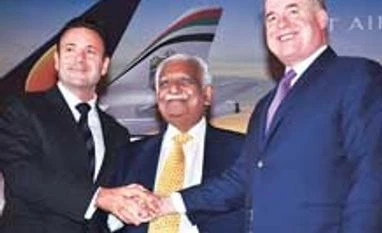 Jet eyes debt restructuring to turn profitable by 2017 Jet Airways CEO-designate Cramer Ball, Chairman Naresh Goyal and Etihad Airways CEO James Hogan