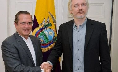 Sweden to question Assange 'soon': Ecuadoran president Ecuador's Foreign Minister Ricardo Patino, left, shakes hands with WikiLeaks founder Julian Assange after a press conference inside the Ecuadorian Embassy in London