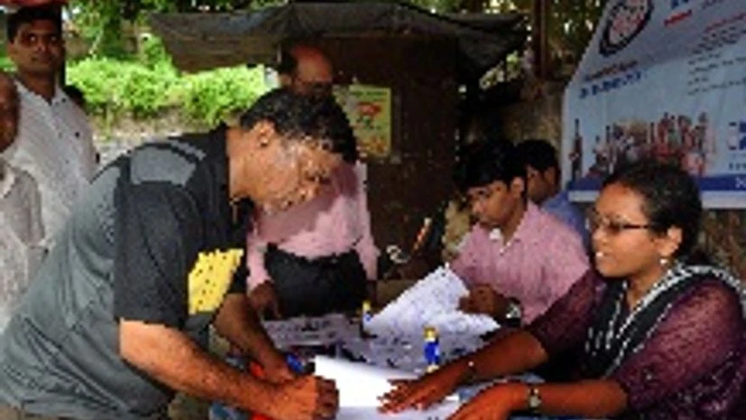 Depositors queued up in Mumbai to get enrolled in Jan Dhan Yojana which rolled out on Thursday Depositors queued up in Mumbai to get enrolled in Jan Dhan Yojana which rolled out on Thursday