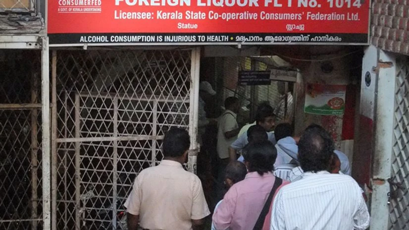 Kerala sees three to five hours wait in queues for liquor Kerala sees three to five hours wait in queues for liquor
