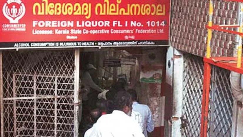 A queue outside a retail liquor shop in Kerala A queue outside a retail liquor shop in Kerala