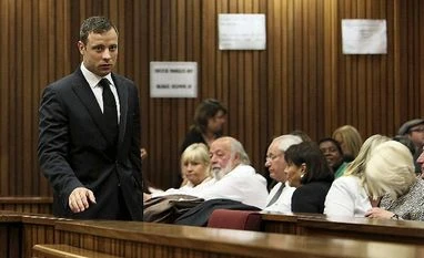 Pistorius sentenced to 6 years in jail for murder of girlfriend Oscar Pistorius, left, passes family members of the late Reeva Steenkamp on his arrival in court in Pretoria, South Africa