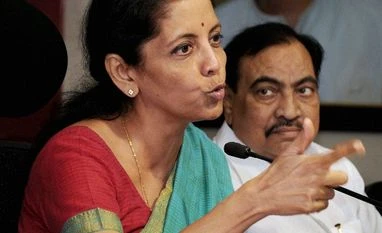India to press for implementation of Bali deal at Nairobi trade talks Nirmala Sitharaman, Union Minister of State Commerce & Industry, adresses the media along with BJP leader Eknath Khadase (R) at party office in Mumbai