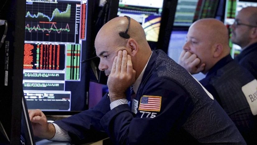 Fred DeMarco, left, and fellow traders work on the floor of the New York Stock Exchange Fred DeMarco, left, and fellow traders work on the floor of the New York Stock Exchange