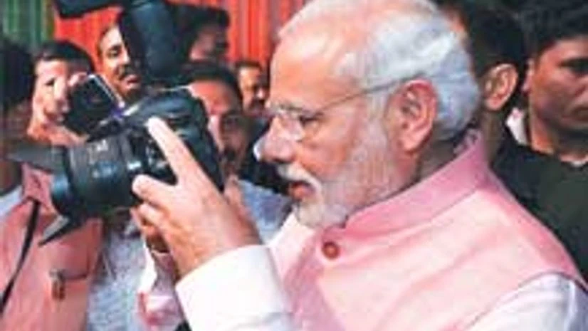rime Minister Narendra Modi clicks photographs at BJP’s ‘Diwali Mangal Milan’ with journalists at the party’s headquarters in New Delhi on Saturday rime Minister Narendra Modi clicks photographs at BJP’s ‘Diwali Mangal Milan’ with journalists at the party’s headquarters in New Delhi on Saturday
