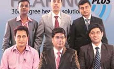 Listen up! A start-up that doubles revenue, every year Somenath Mukherjee (centre, foreground), founder, Hearing Plus, with his team-members