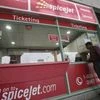 A passenger stands outside the SpiceJet Airlines ticket counter at the domestic airport on the outskirts of Agartala