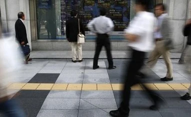 Japan inflation slows and output slips, keep BOJ under pressure