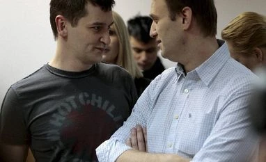 Kremlin foe Navalny gets suspended sentence, calls for protests