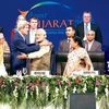 Prime Minister Narendra Modi (3rd from left) with US Secretary of State John Kerry (2nd from left) at the inaugural session of Vibrant Gujarat Summit in Gandhinagar on Sunday