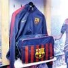 FC Barca’s bags and jerseys seen next to its star player, Neymar Jr