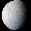 This June 28, 2009 image provided by NASA, taken by the international Cassini spacecraft, shows Enceladus, one of Saturn's moons. A new study published online Wednesday, March 11, 2015, in the journal Nature, suggests there are ongoing interactions.