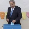 Israeli Prime Minister Benjamin Netanyahu casts his vote during Israel's parliamentary elections in Jerusalem