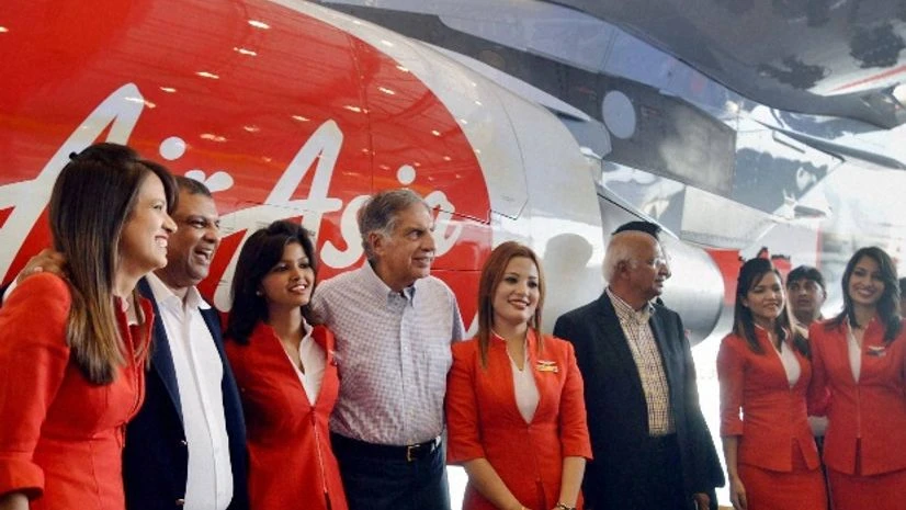 Ratan N Tata and S Ramadorai, Non-Executive Chairman AirAsia India with airhostesses at the unveiling of AirAsia's 4th aircraft with JRD Tata Livery at Shamshabad Airport near Hyderabad Ratan N Tata and S Ramadorai, Non-Executive Chairman AirAsia India with airhostesses at the unveiling of AirAsia's 4th aircraft with JRD Tata Livery at Shamshabad Airport near Hyderabad