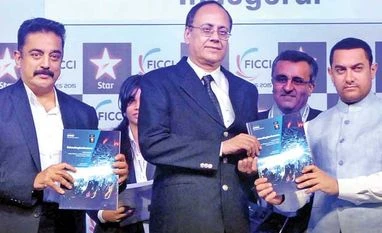 By 2018, TV ad revenue will exceed print's From left: Veteran actor Kamal Haasan, Ministry of Information and Broadcasting Additional Secretary J S Mathur and Bollywood actor Aamir Khan release the Ficci-KPMG report at the inaugural session of FICCI Frames 2015