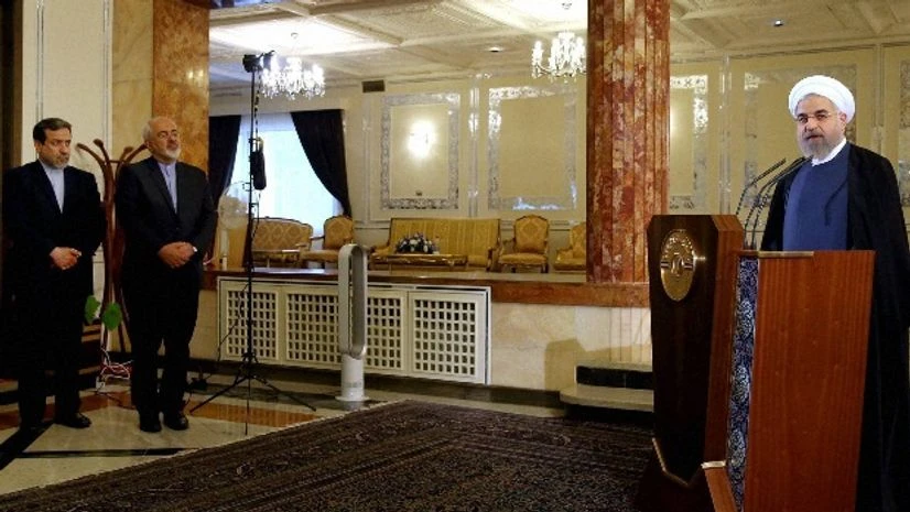 A file photo of Iranian President Hassan Rouhani, right, speaking at a news briefing, while his Foreign Minister Mohammad Javad Zarif, second left, deputy Foreign Minister Abbas Araghchi, first left, listen, at the Saadabad palace in Tehran, Iran A file photo of Iranian President Hassan Rouhani, right, speaking at a news briefing, while his Foreign Minister Mohammad Javad Zarif, second left, deputy Foreign Minister Abbas Araghchi, first left, listen, at the Saadabad palace in Tehran, Iran