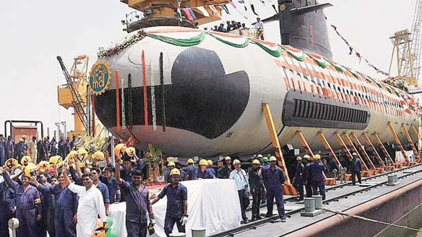 Workers and engineers from Mazagon Dock Ltd cheer during the floating out of the first project 75 (Scorpene) submarine on pontoon at the Mazagon dock, in Mumbai Workers and engineers from Mazagon Dock Ltd cheer during the floating out of the first project 75 (Scorpene) submarine on pontoon at the Mazagon dock, in Mumbai