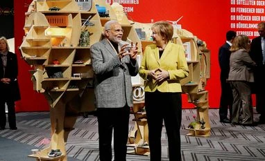 Modi-Merkel to discuss steps to scale up Indo-German ties Prime Minister Narendra Modi and German Chancellor Angela Merkel Picture by PTI File photo