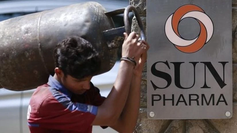 A man carrying a gas cylinder walks out of the research and development centre of Sun Pharmaceutical Industries Ltd in Mumbai A man carrying a gas cylinder walks out of the research and development centre of Sun Pharmaceutical Industries Ltd in Mumbai