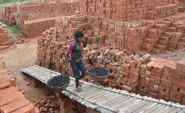 Govt plans to ban burnt clay bricks from its projects to save environment A labourer works at a brick field. File photo: PTI