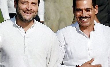Vadra's name dropped from 'no-frisking' list Rahul Gandhi with Robert Vadra. File photo