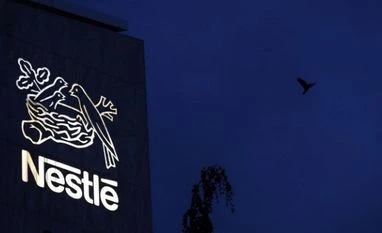 Nestle sells US confectionery biz to Ferrero for $2.8 bn amid health push A bird flies past the logo at the headquarters of world food giant Nestle in Vevey