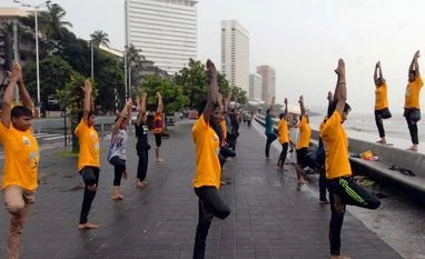 Surya Namaskar in civic schools: Bombay HC declines stay Surya Namaskar performed by Mumbaikars on International Yoga Day at Marine Drive, Mumbai. (File Photo: Kamlesh Pednekar)