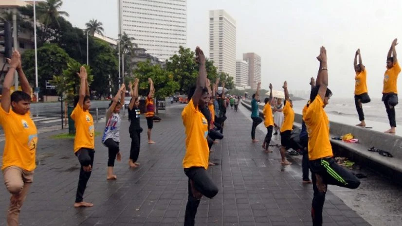 Surya Namaskar performed by Mumbaikars on International Yoga Day at Marine Drive, Mumbai. (File Photo: Kamlesh Pednekar) International Yoga Day