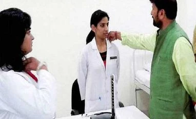 Image of J&K health minister correcting lady doctor's collar goes viral
