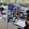 Employees of Tata Consultancy Services (TCS) work inside the company headquarters in Mumbai