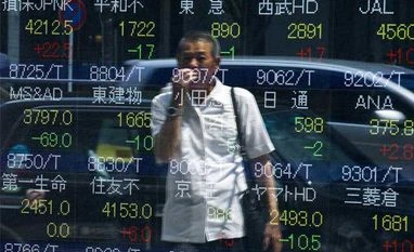 Asian shares firm, dollar up as China devalues yuan
