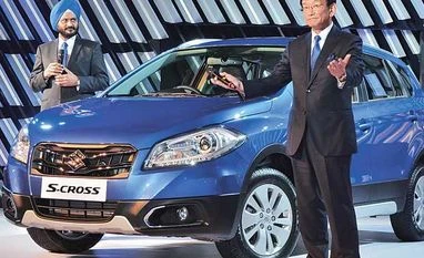I see possibility of 100 per cent product development in India: Maruti Suzuki MD and CEO Kenichi Ayukawa (right), MD & CEO, and R S Kalsi, executive director (marketing & sales), at the launch of S-Cross in New Delhi, on Wednesday
