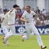 In this file photo, England's Stuart Broad, right, celebrates taking the wicket of Australia's Steve Smith caught by Joe Root for 0 on the first day of the fourth Ashes test cricket match between England and Australia at Trent Bridge cricket ground i