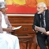 Oomen Chandy & Narendra Modi. File photo